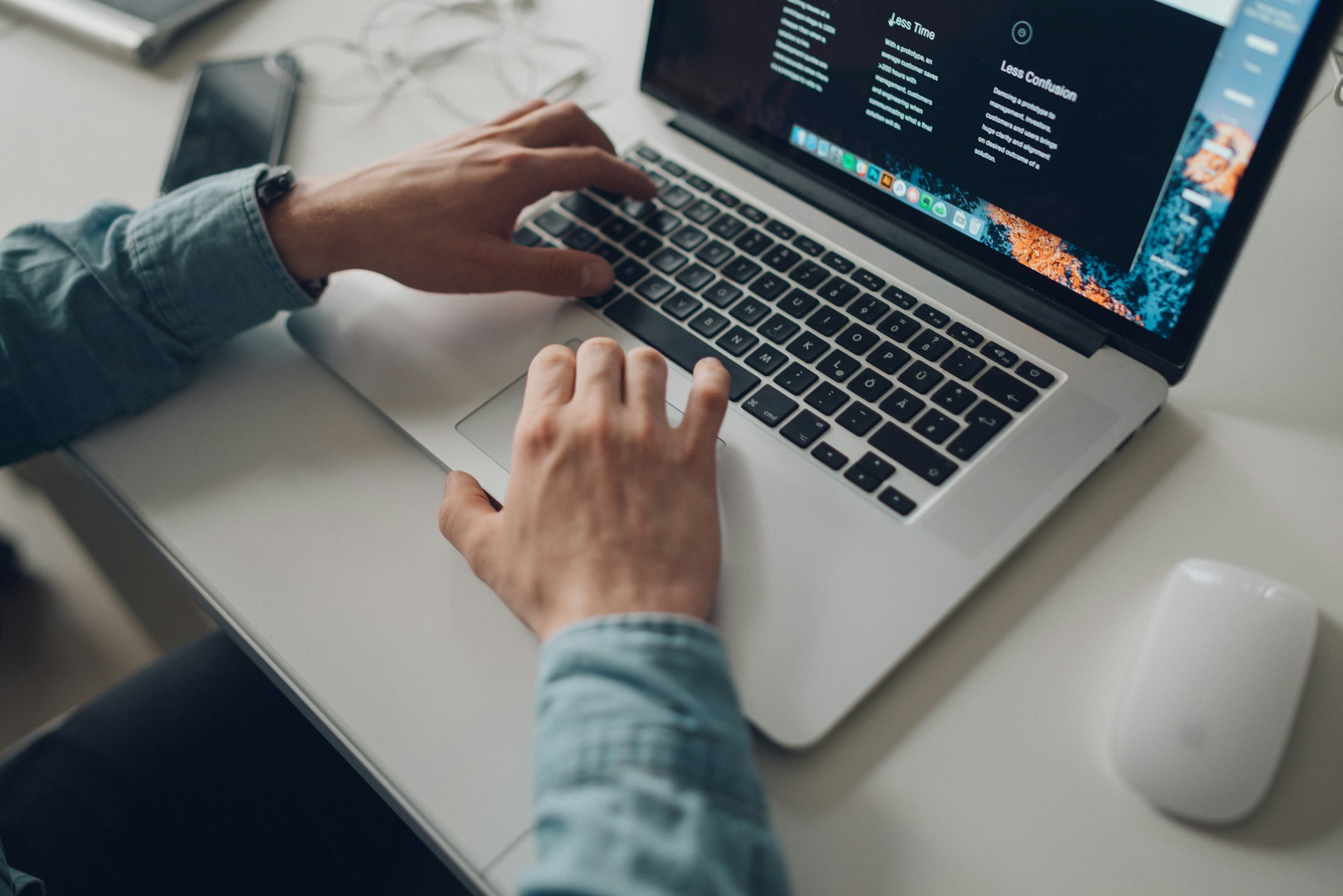 person typing on laptop - What is an AI Content Writer